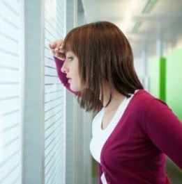 Person peeking out window